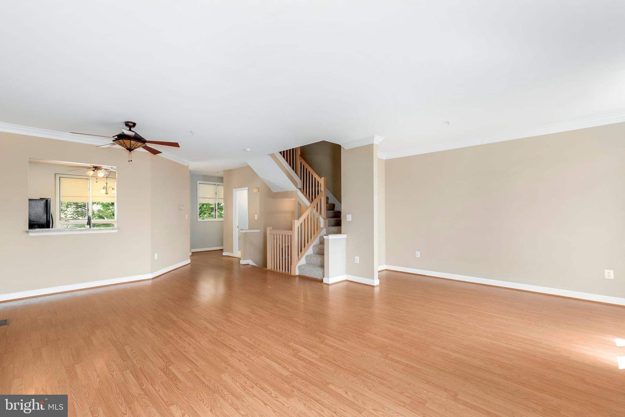 106 Lancefield Road Baltimore, MD 21209 - Photo 7 of 37 an empty room with wooden floor and windows