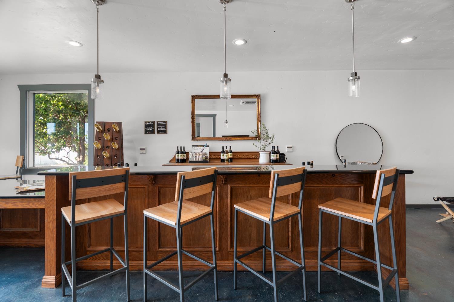 6539 East Peltier Road Acampo, CA 95220 - Photo 13 of 70 a kitchen with stainless steel appliances granite countertop a table chairs and a refrigerator