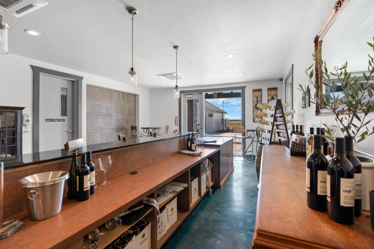 6539 East Peltier Road Acampo, CA 95220 - Photo 17 of 70 a large kitchen with lots of counter space and wooden floor