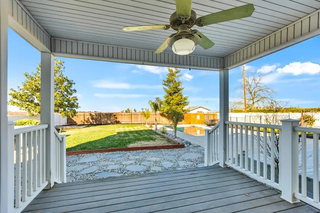 a bedroom with a bed couch and window