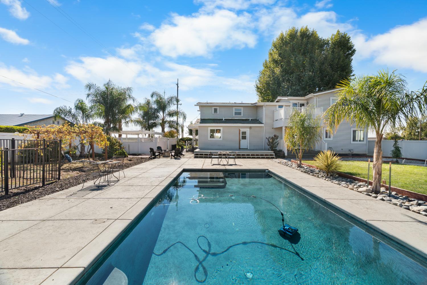 6539 East Peltier Road Acampo, CA 95220 - Photo 32 of 70 a swimming pool with outdoor seating and yard