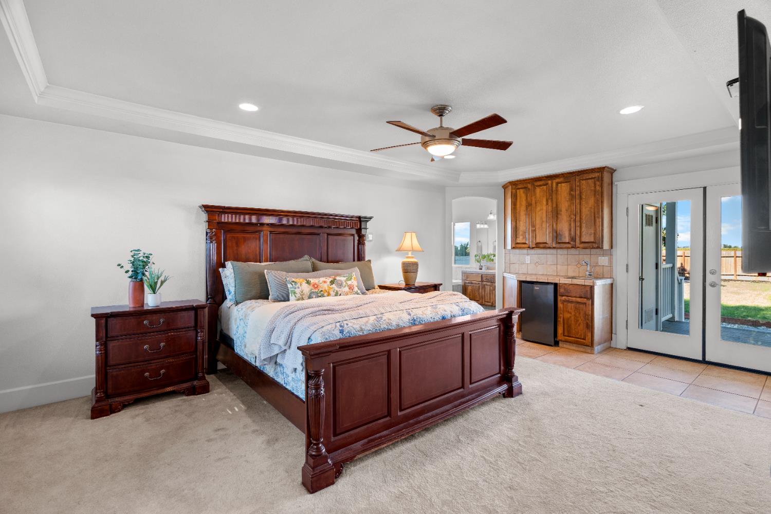 6539 East Peltier Road Acampo, CA 95220 - Photo 40 of 70 a spacious bedroom with a bed and a fireplace