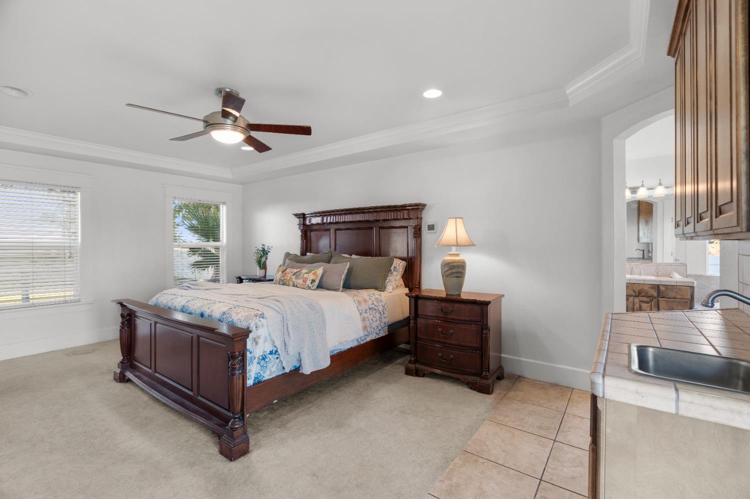 6539 East Peltier Road Acampo, CA 95220 - Photo 41 of 70 a bedroom with a bed couch and window