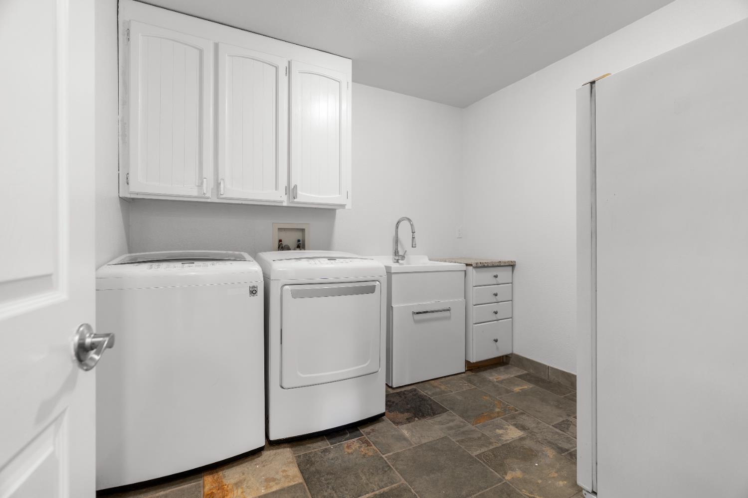 6539 East Peltier Road Acampo, CA 95220 - Photo 49 of 70 a view of storage and utility room with washer and dryer