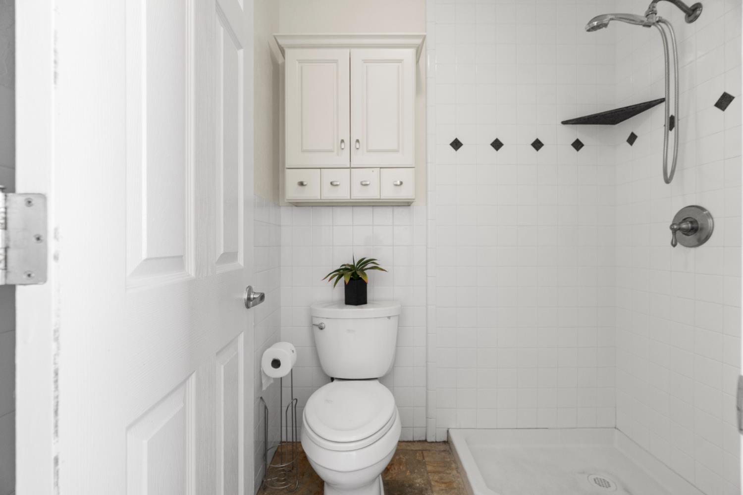 6539 East Peltier Road Acampo, CA 95220 - Photo 50 of 70 a white toilet sitting next to a bathroom sink