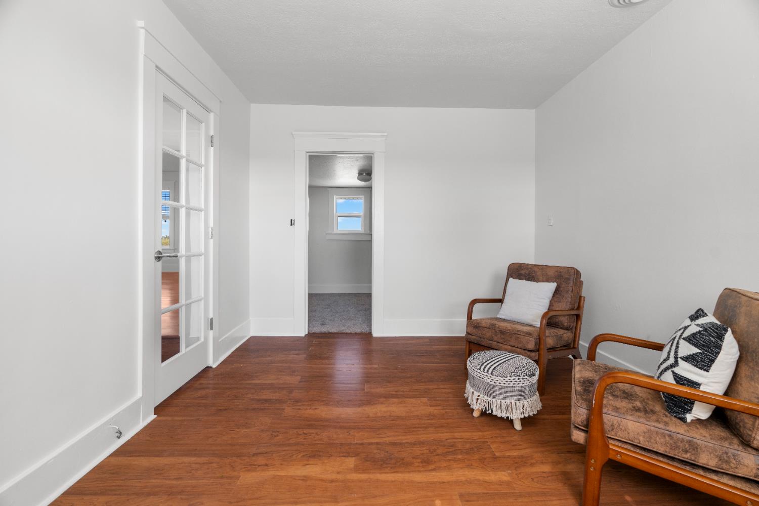 6539 East Peltier Road Acampo, CA 95220 - Photo 52 of 70 a room with wooden floor and lounge chair