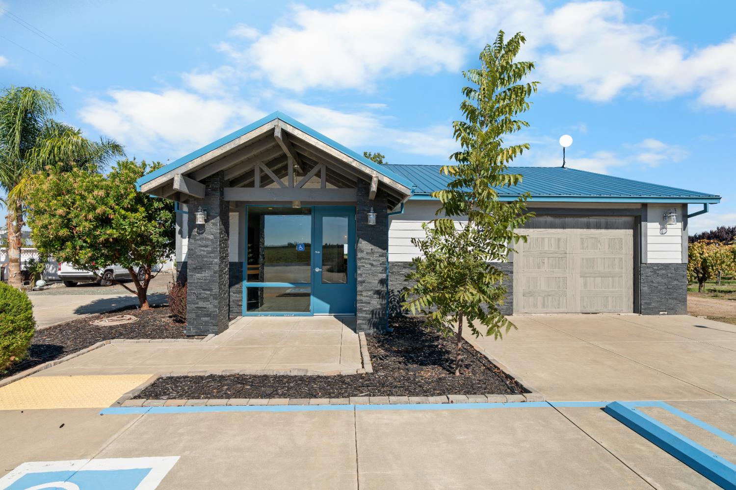 6539 East Peltier Road Acampo, CA 95220 - Photo 9 of 70 a front view of a house with garden