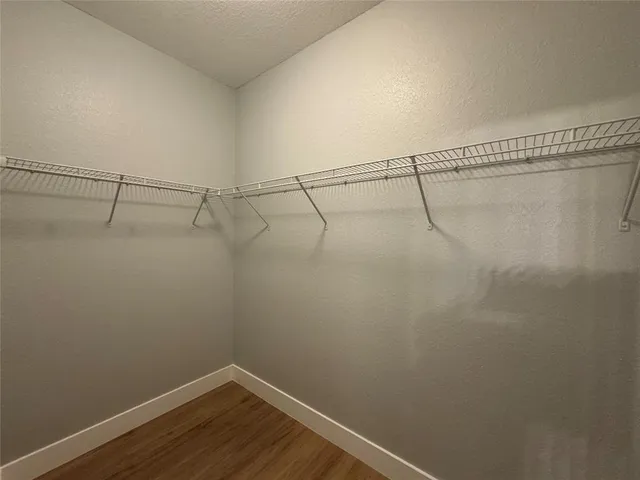 a view of a room with racks on the wall