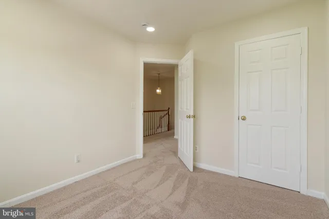 a view of an empty room and a window