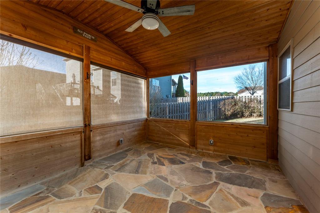624 East Hampton Place Canton, GA 30115 - Photo 26 of 37 a view of empty room with wooden floor and fan