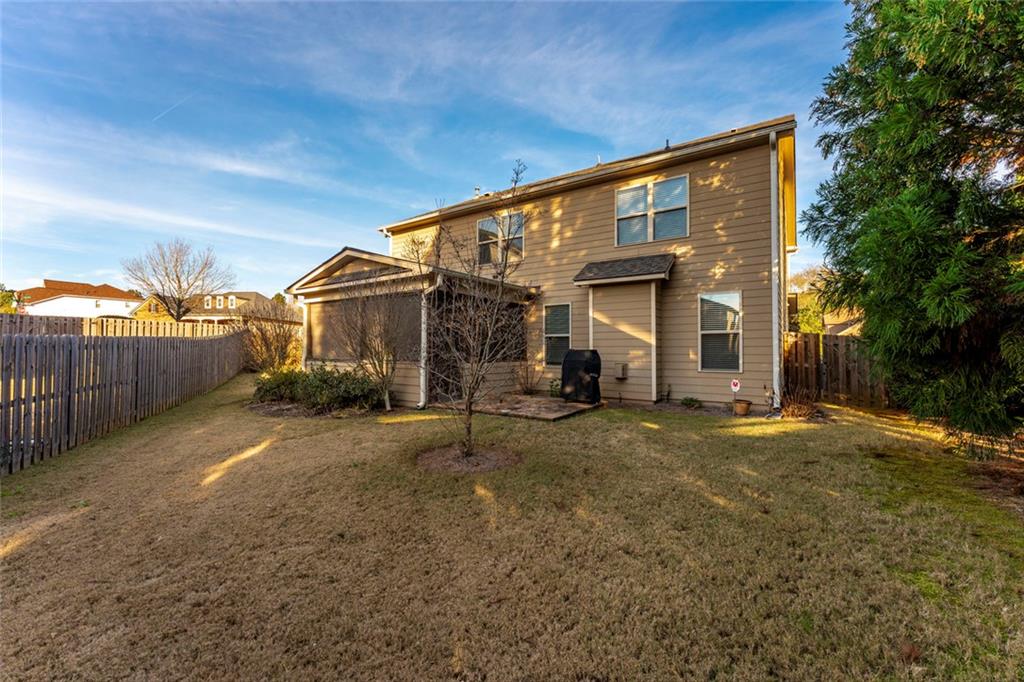 624 East Hampton Place Canton, GA 30115 - Photo 31 of 37 a view of a house with backyard and garden