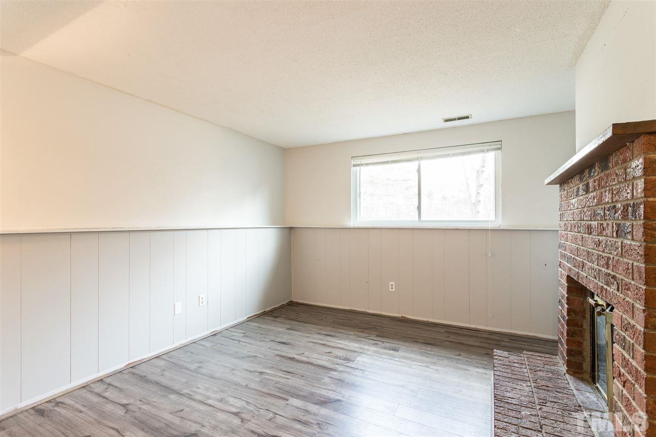 8005 Mourning Dove Road Raleigh, NC 27615 - Photo 13 of 22 The perfect space for relaxing- this bonus room gets great natural light and has a wood burning fireplace!
