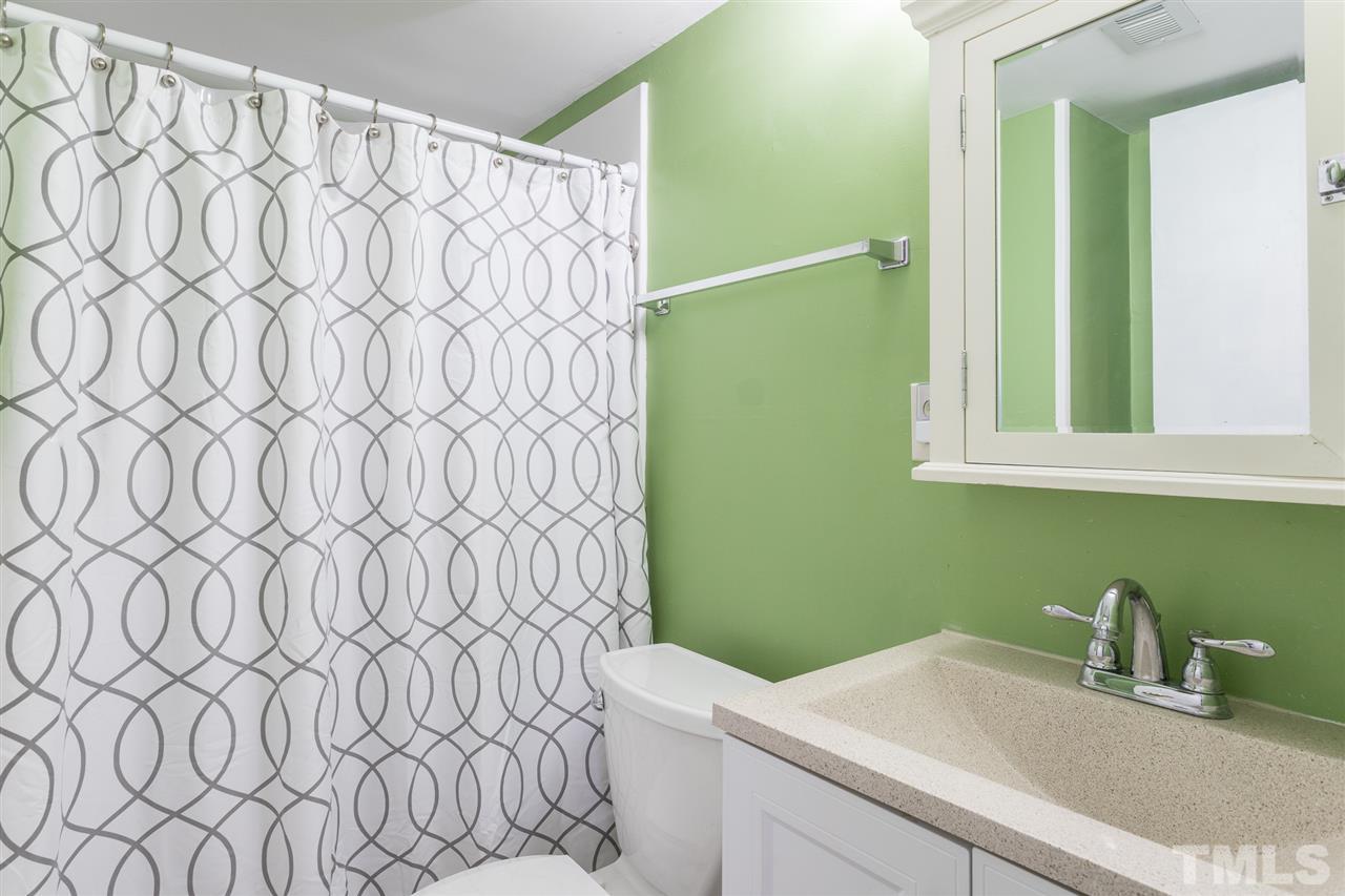 8005 Mourning Dove Road Raleigh, NC 27615 - Photo 18 of 22 Second full bathroom on the lower level convenient for the third and fourth bedrooms, as well as the bonus room.