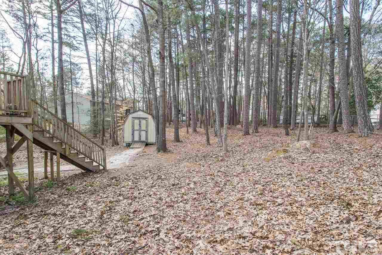 8005 Mourning Dove Road Raleigh, NC 27615 - Photo 21 of 22 Nice, private backyard complete with a shed for even more storage options.