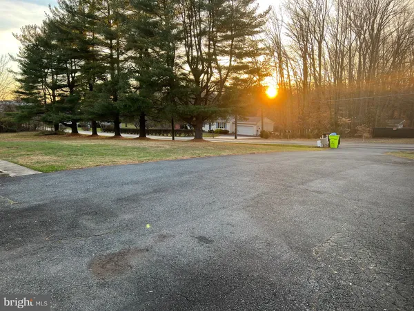 a view of a playground with basketball court