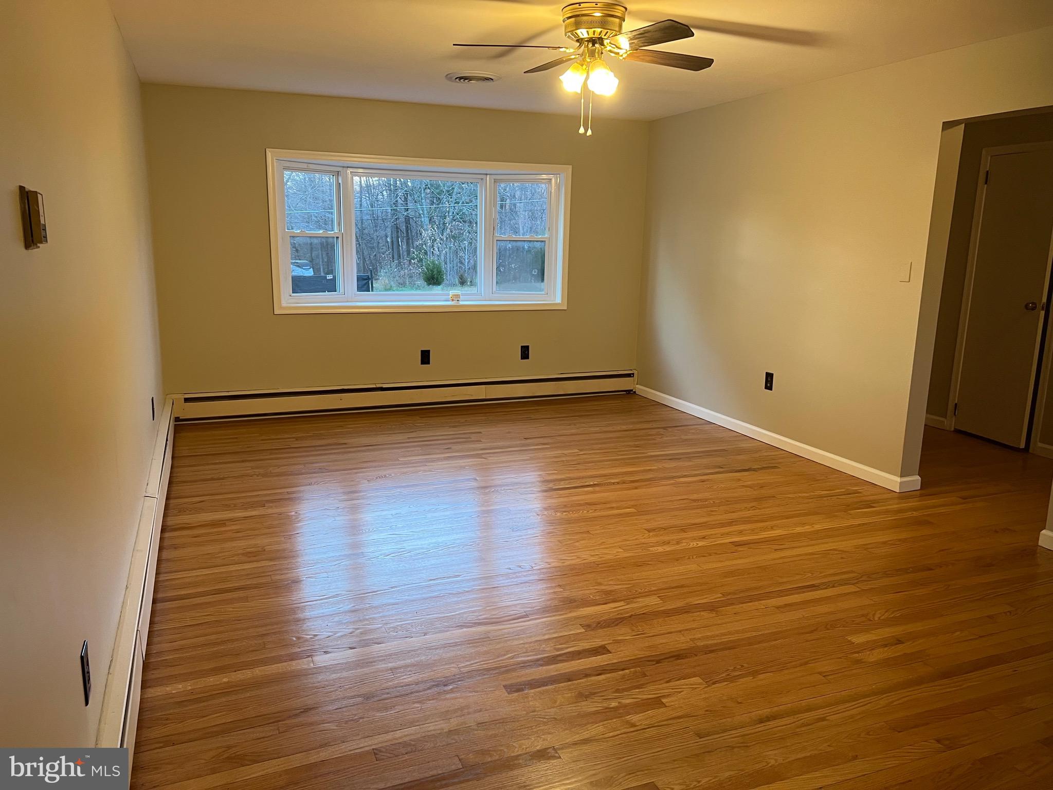 913 South Stepney Road Aberdeen, MD 21001 - Photo 9 of 21 an empty room with wooden floor and windows