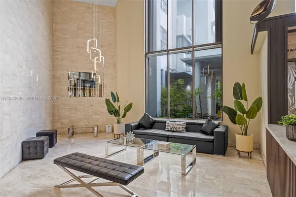 a bathroom with a sink shower and a mirror