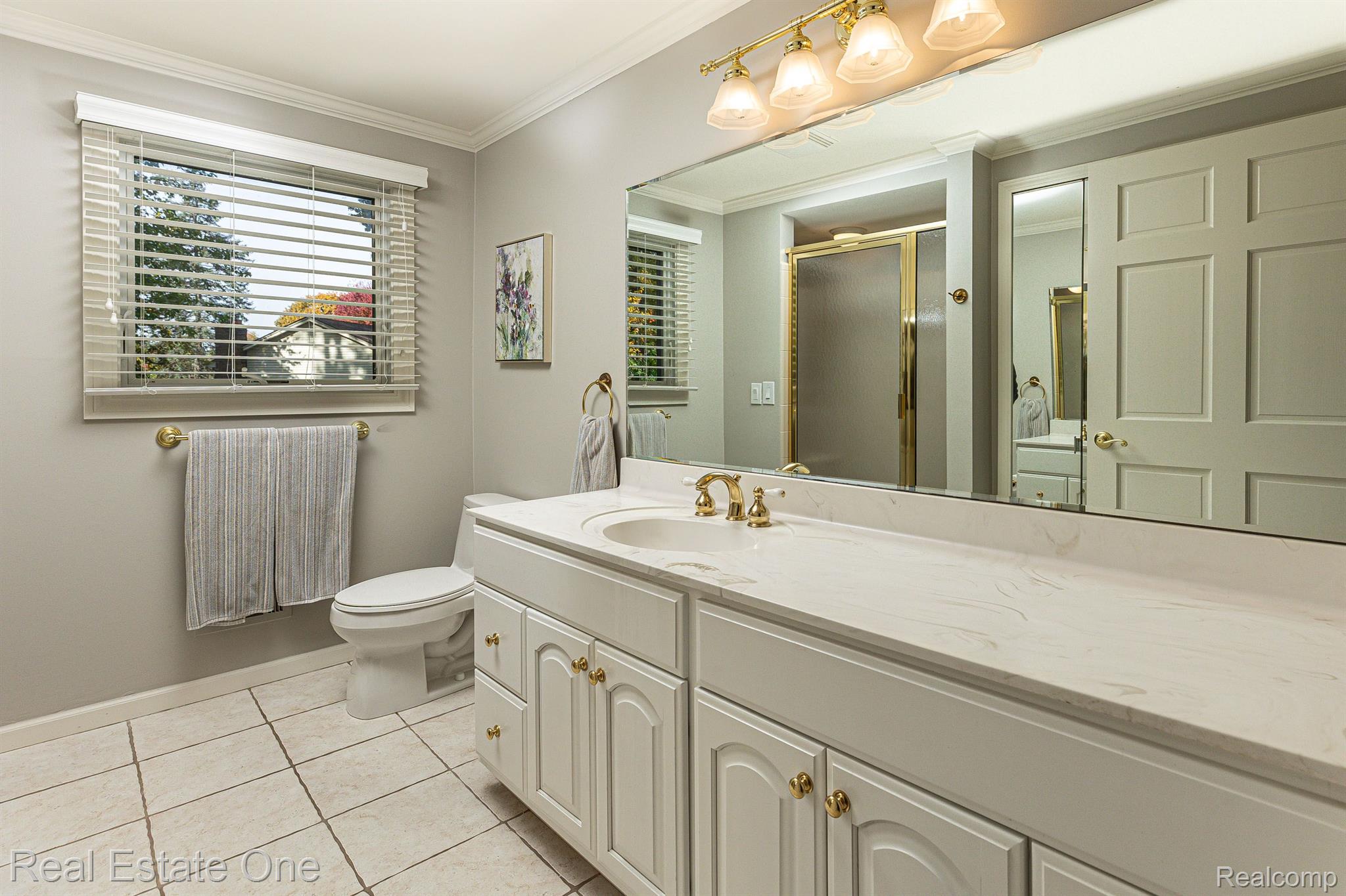 11700 Raintree Court Utica, MI 48315 - Photo 18 of 35 Full bath with ceramic tile flooring and shower