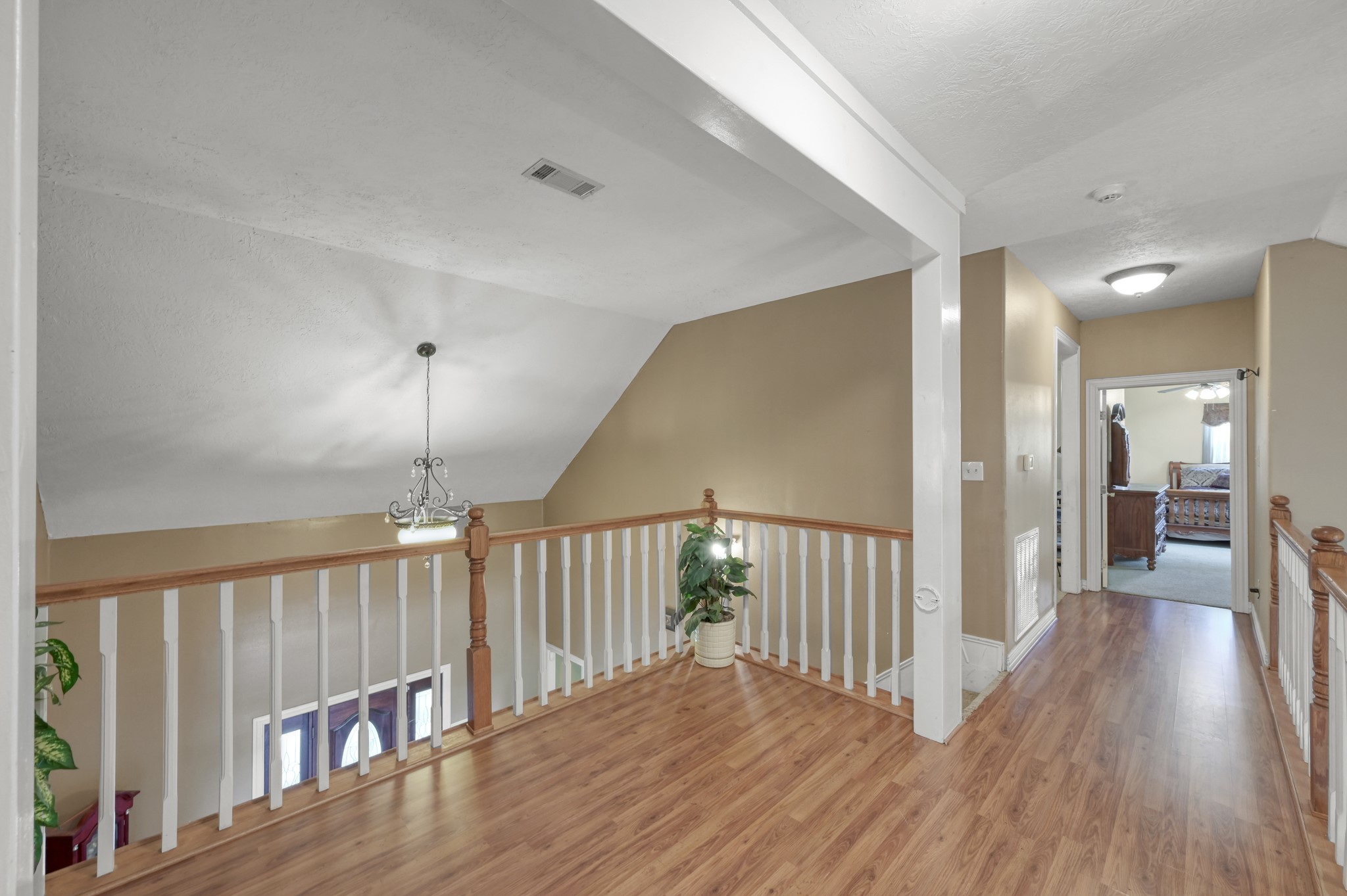 144 Wood Farm Road Huntsville, TX 77320 - Photo 18 of 35 a view of a hallway with wooden floor and door