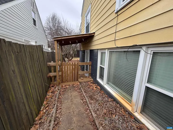 a view of a backyard with sitting area