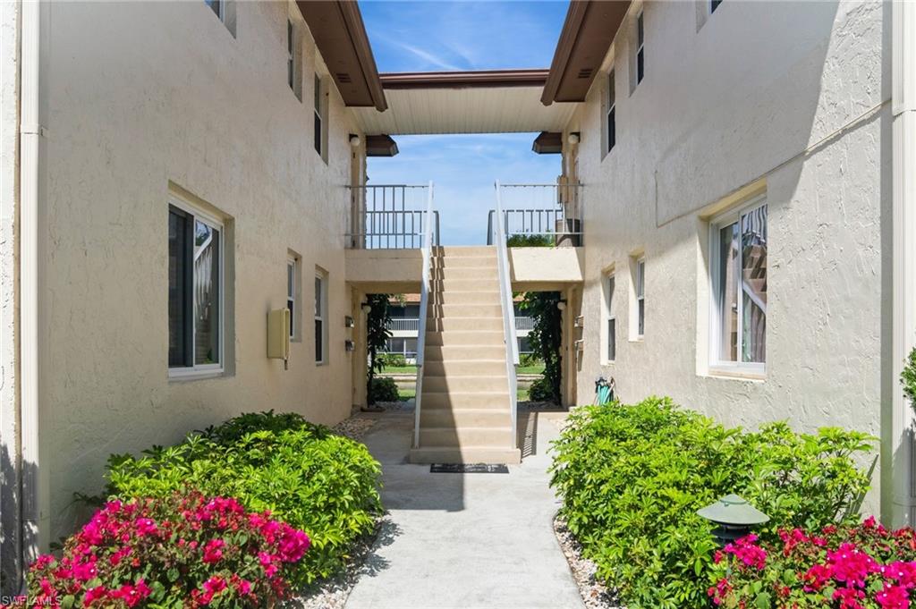 1155 Sandpiper Street, Unit B3 Naples, FL 34102 - Photo 17 of 21 Entrance to property with stucco siding