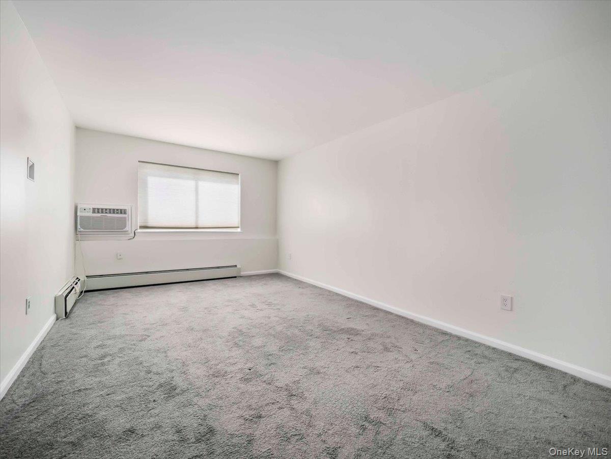 27 Tanager Road, Unit 2702 Monroe, NY 10950 - Photo 23 of 35 Carpeted interior space with white walls and baseboards