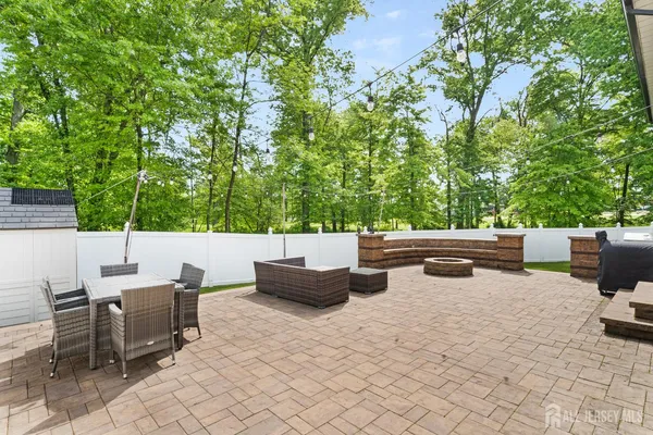 a view of backyard with sitting area