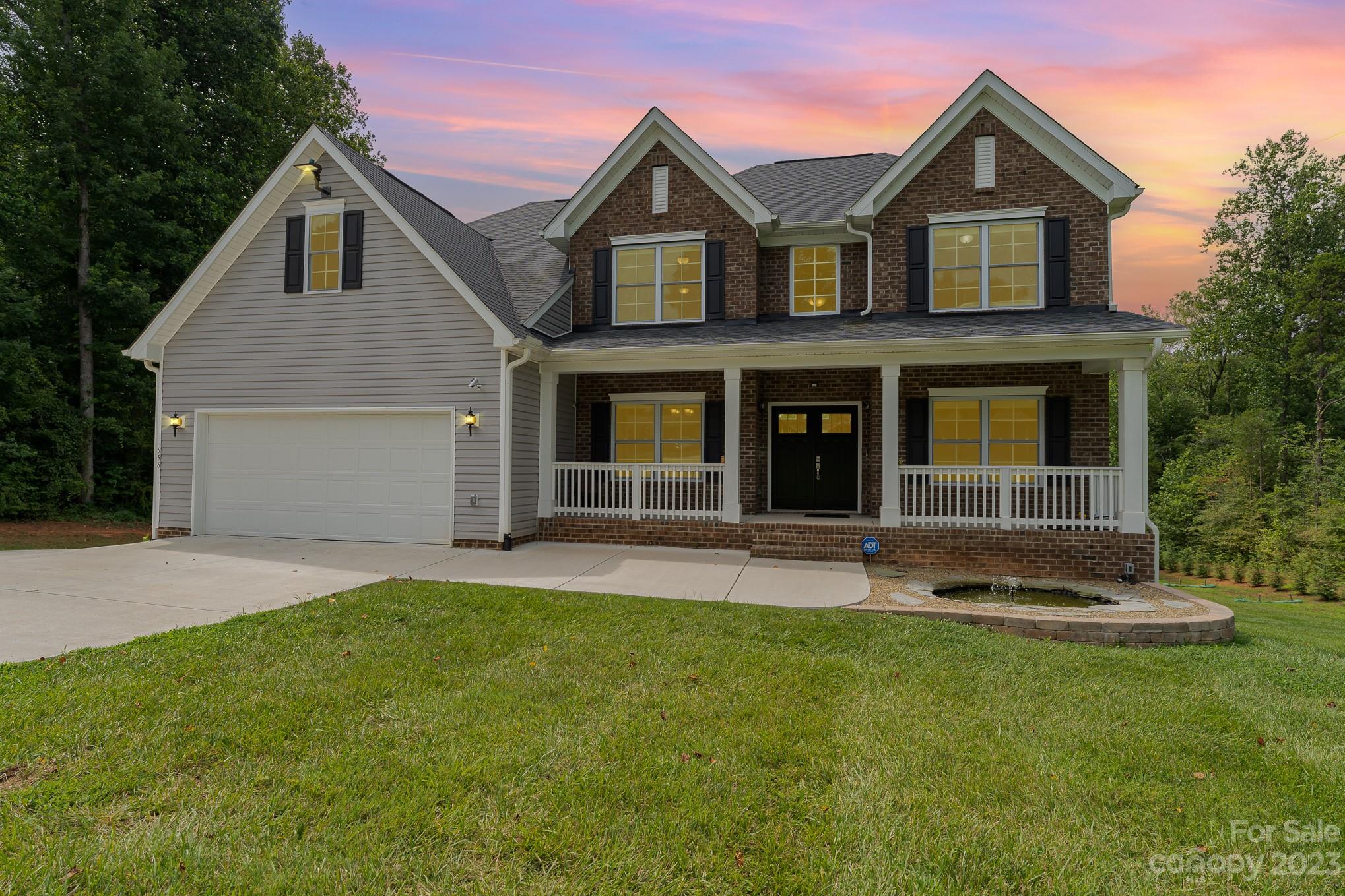 556 Sain Road Mocksville, NC 27028 - Photo 1 of 48 a front view of a house with a yard and garage