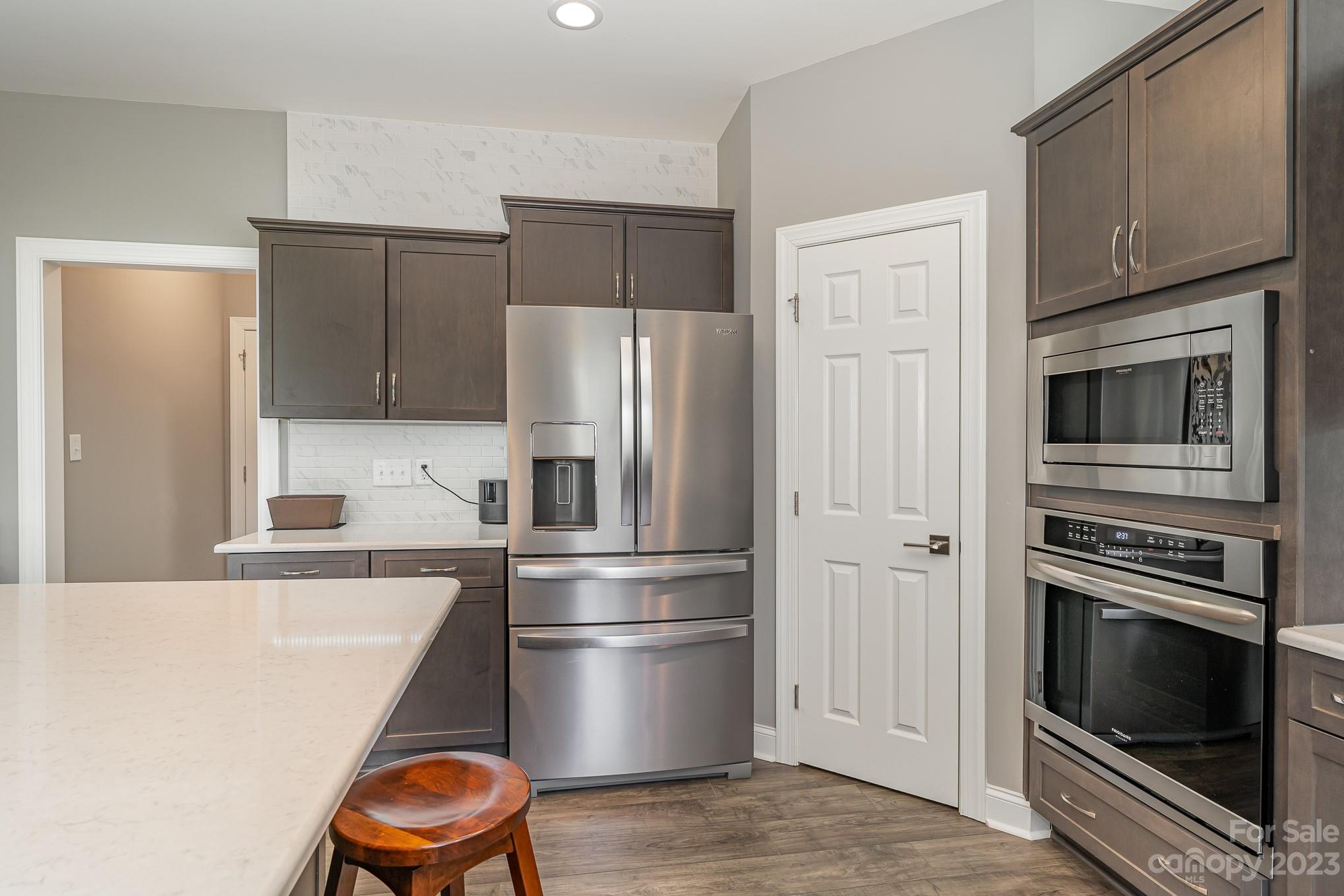 556 Sain Road Mocksville, NC 27028 - Photo 24 of 48 a kitchen with stainless steel appliances a refrigerator stove and microwave