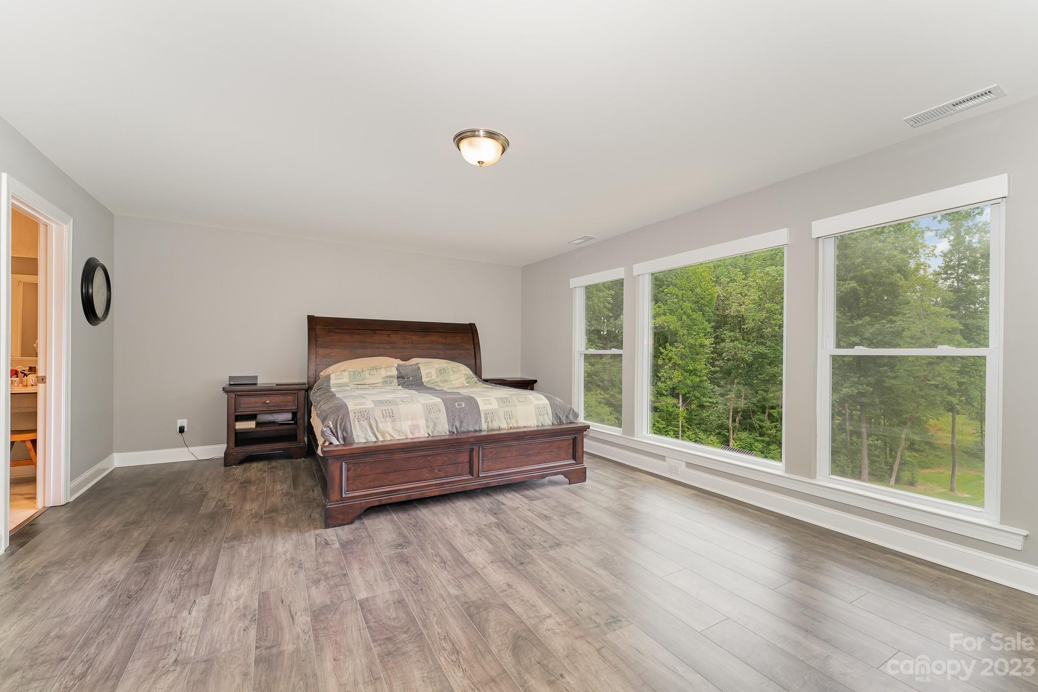 556 Sain Road Mocksville, NC 27028 - Photo 34 of 48 a bed sitting in a spacious bedroom next to a window