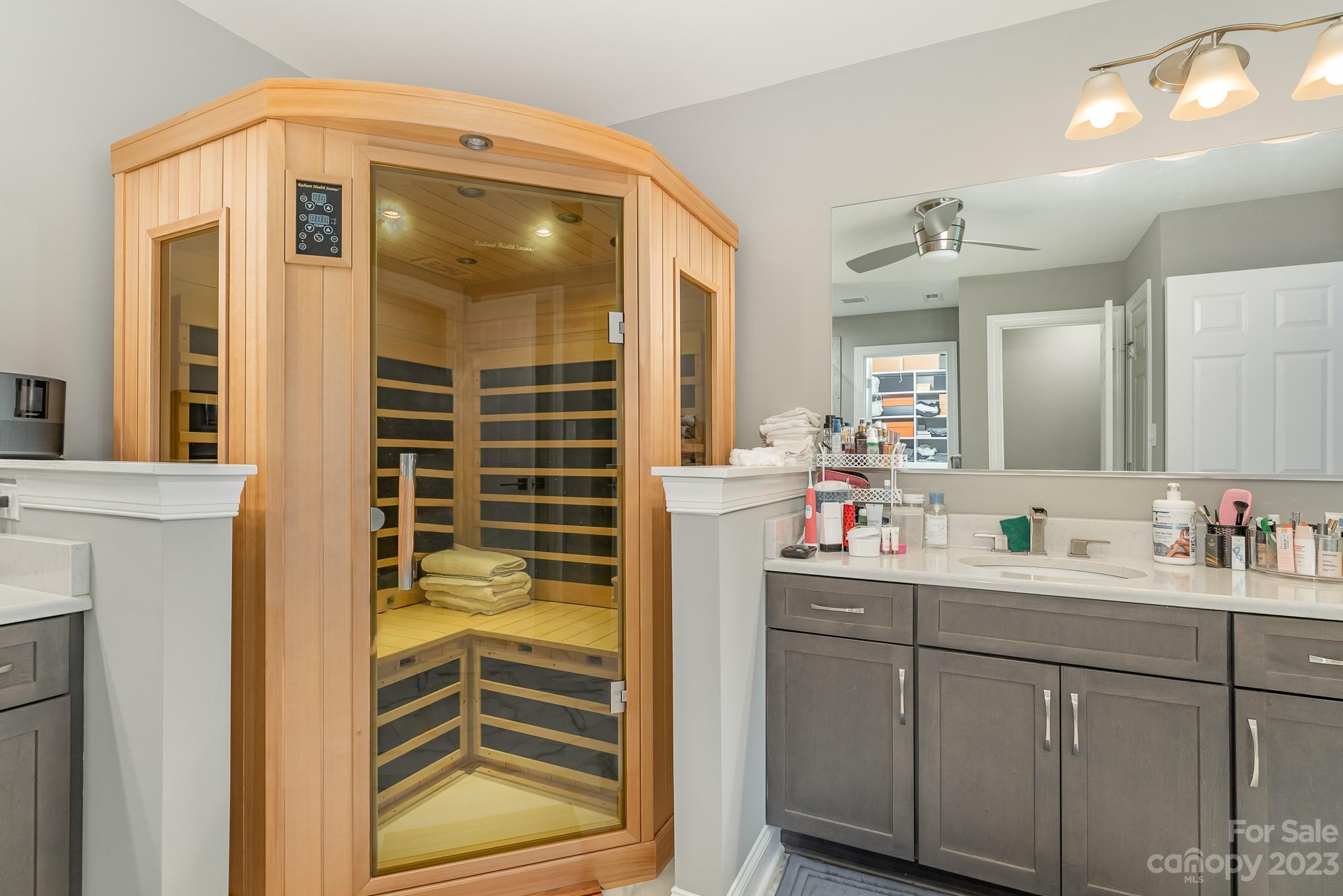 556 Sain Road Mocksville, NC 27028 - Photo 38 of 48 a bathroom with a sink a mirror and next to a window