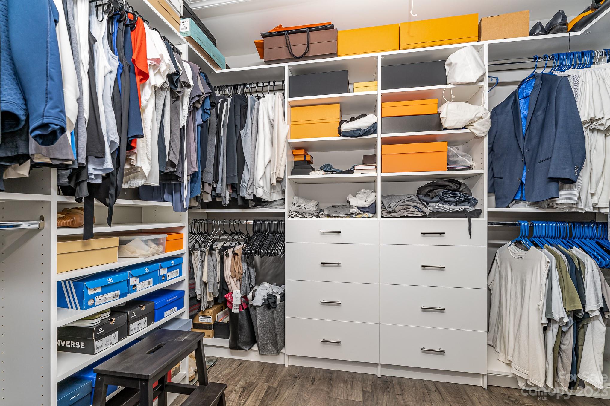 556 Sain Road Mocksville, NC 27028 - Photo 40 of 48 a view of walk in closet with clothes and shoes