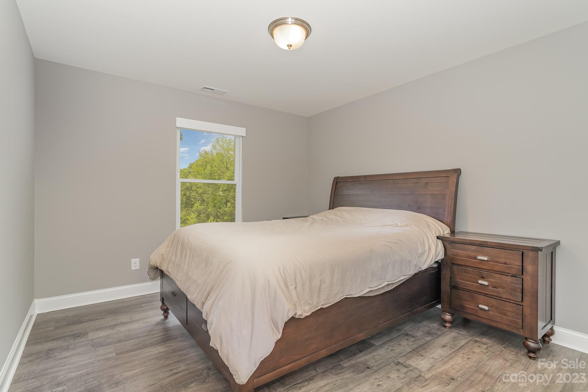 556 Sain Road Mocksville, NC 27028 - Photo 41 of 48 a bedroom with a bed and a window