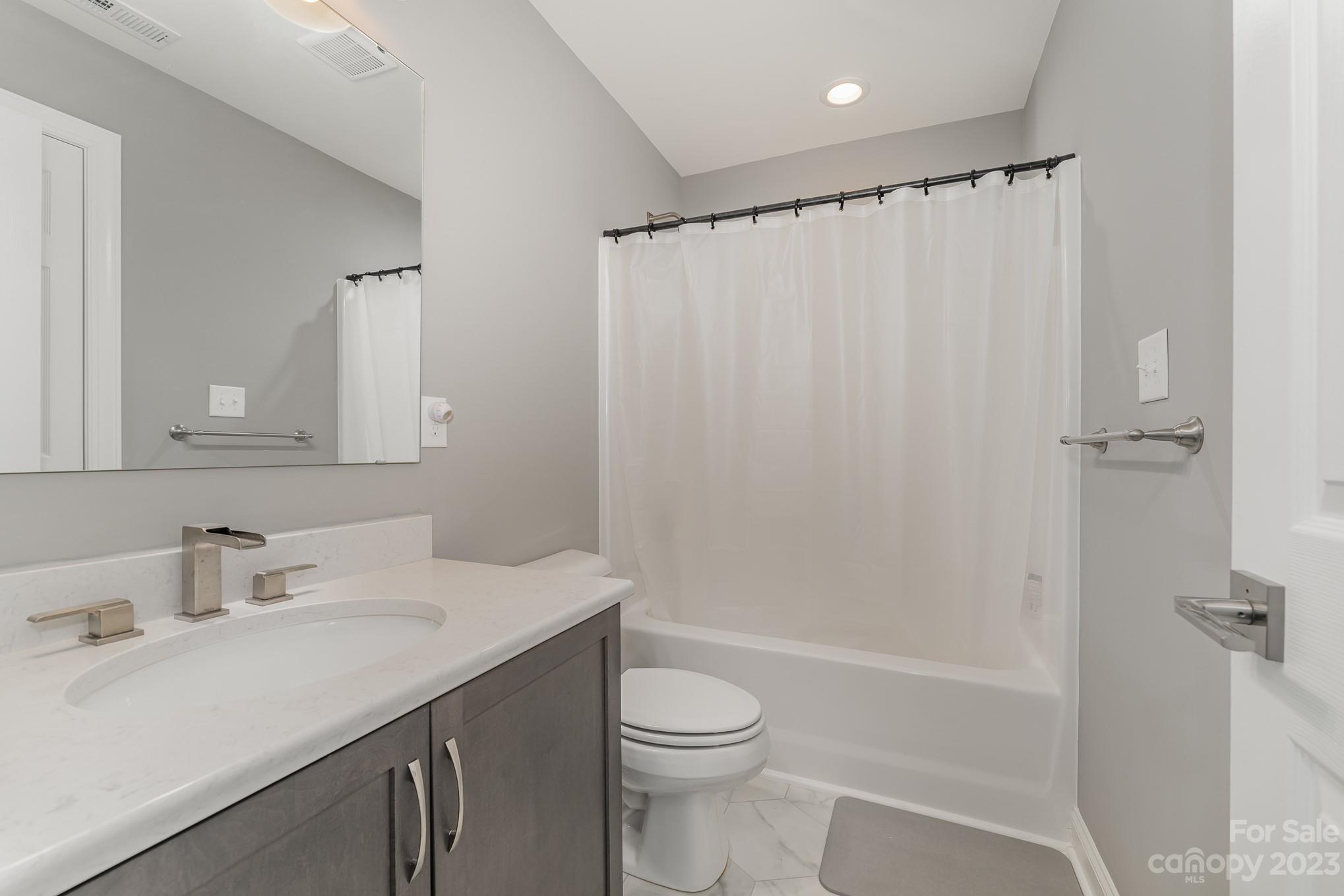 556 Sain Road Mocksville, NC 27028 - Photo 43 of 48 a bathroom with a sink toilet and shower