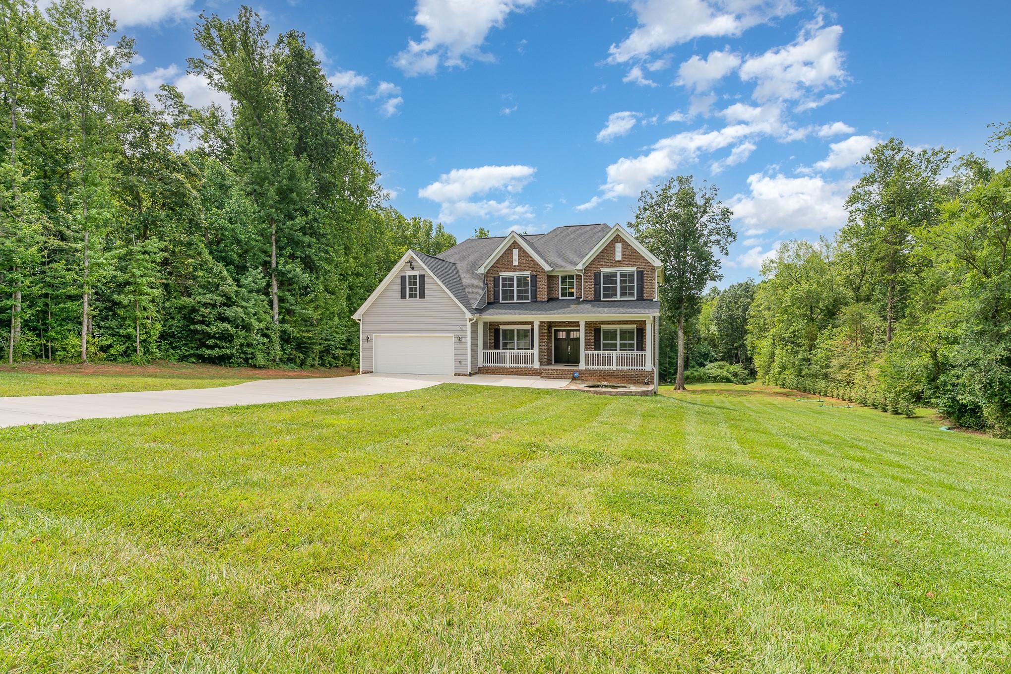 556 Sain Road Mocksville, NC 27028 - Photo 5 of 48 a front view of a house with a yard