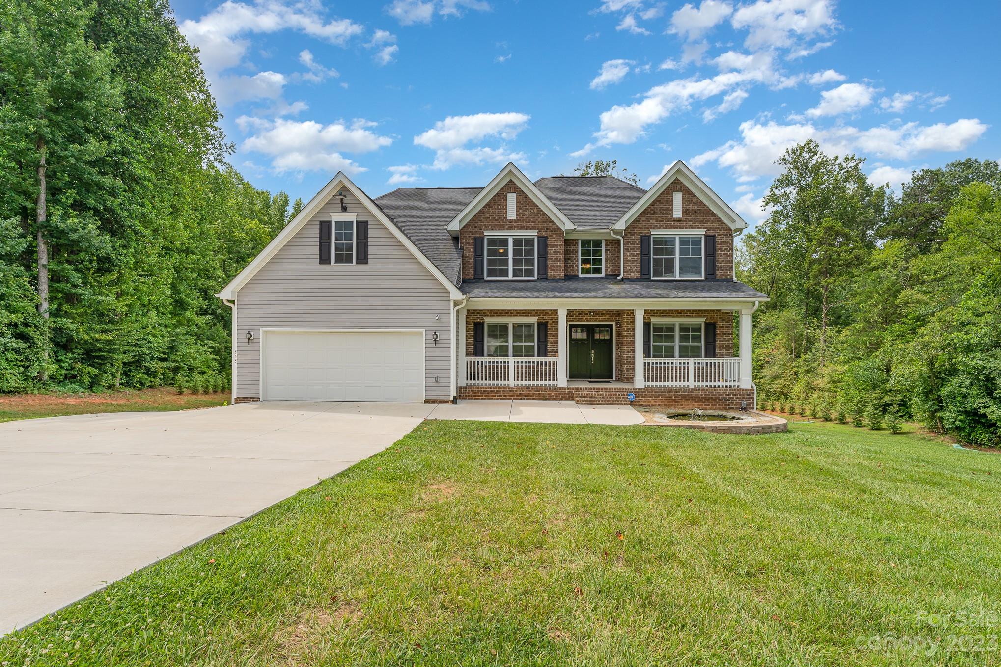 556 Sain Road Mocksville, NC 27028 - Photo 7 of 48 a front view of a house with a yard