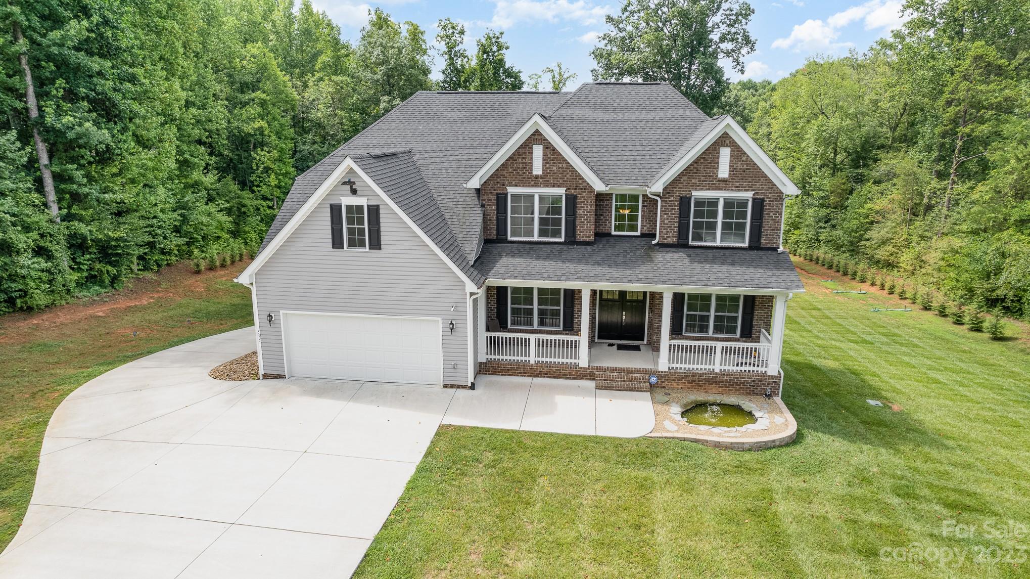 556 Sain Road Mocksville, NC 27028 - Photo 8 of 48 a view of a house with yard and sitting area