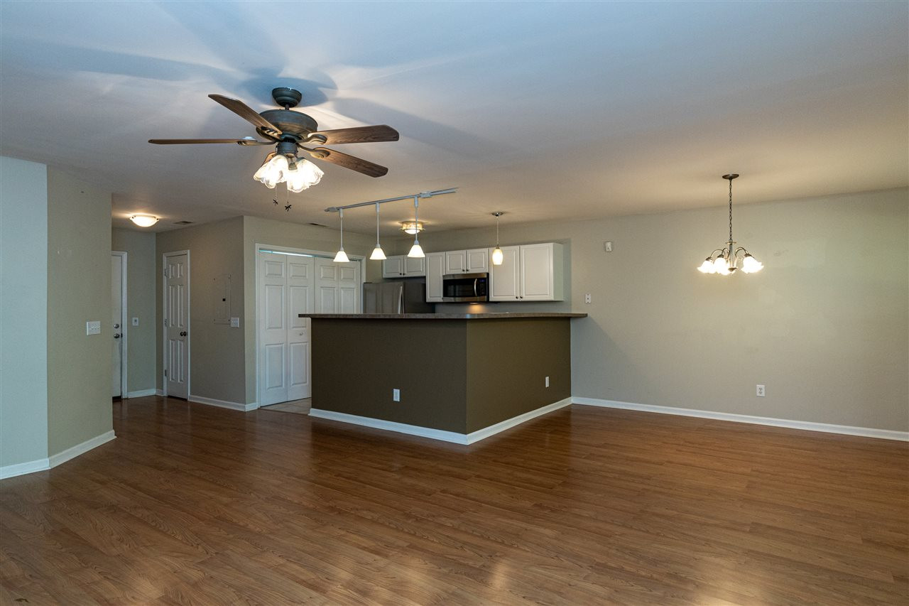 3812 Wellington Ridge Loop, Unit 12 Cary, NC 27518 - Photo 8 of 30 Living Room & Kitchen