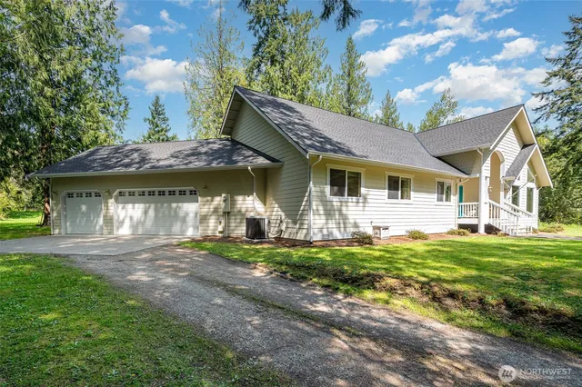 a front view of a house with a yard table and chairs