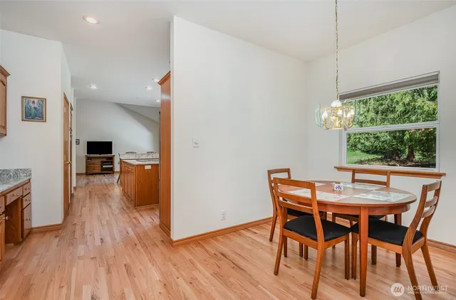 a view of a dining room with furniture window and wooden floor