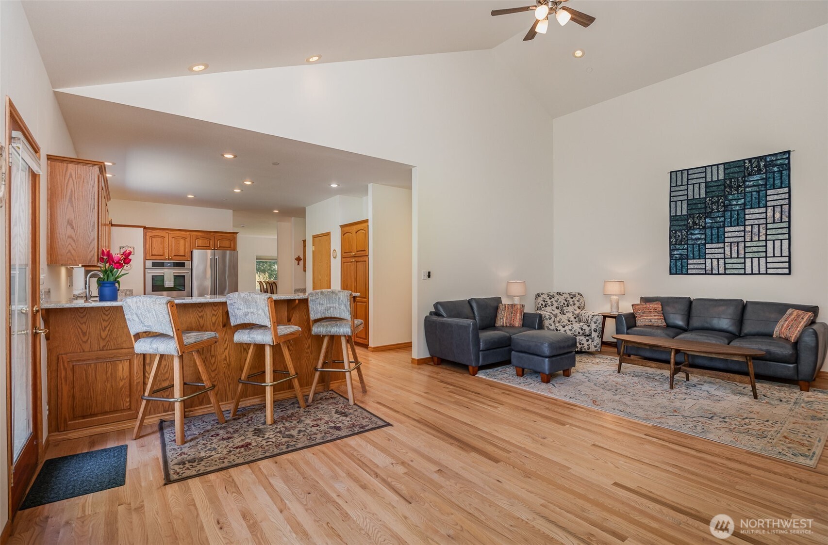 19716 Southeast 220th Street Renton, WA 98058 - Photo 14 of 36 a living room with furniture and a wooden floor