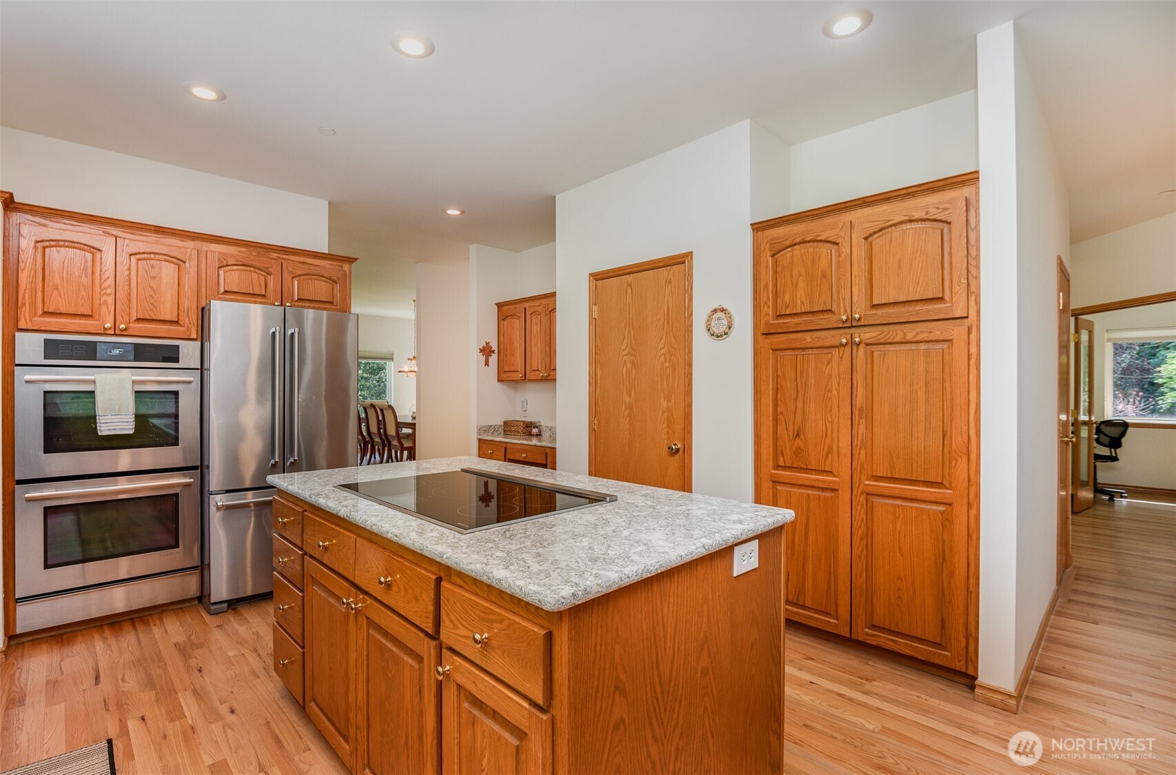 19716 Southeast 220th Street Renton, WA 98058 - Photo 15 of 36 a kitchen with stainless steel appliances granite countertop a refrigerator and a sink