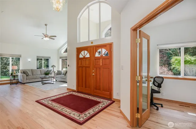 a living room with furniture rug and window