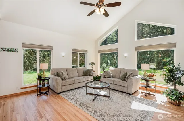 a living room with furniture and a large window