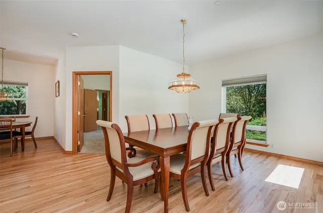 a view of a dining room with furniture window and wooden floor