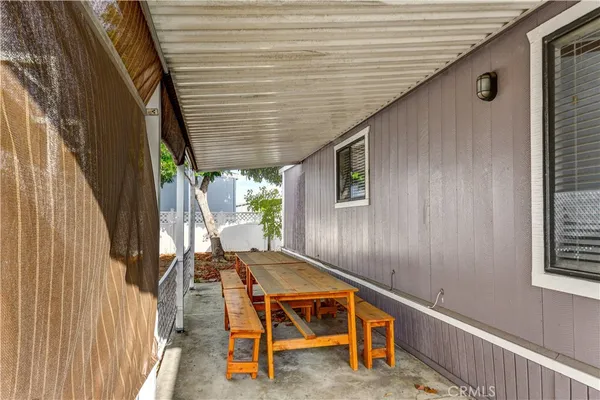 a backyard of a house with outdoor seating