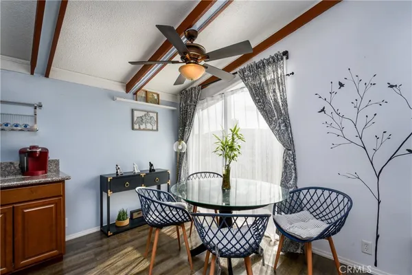 a dining room with furniture and window
