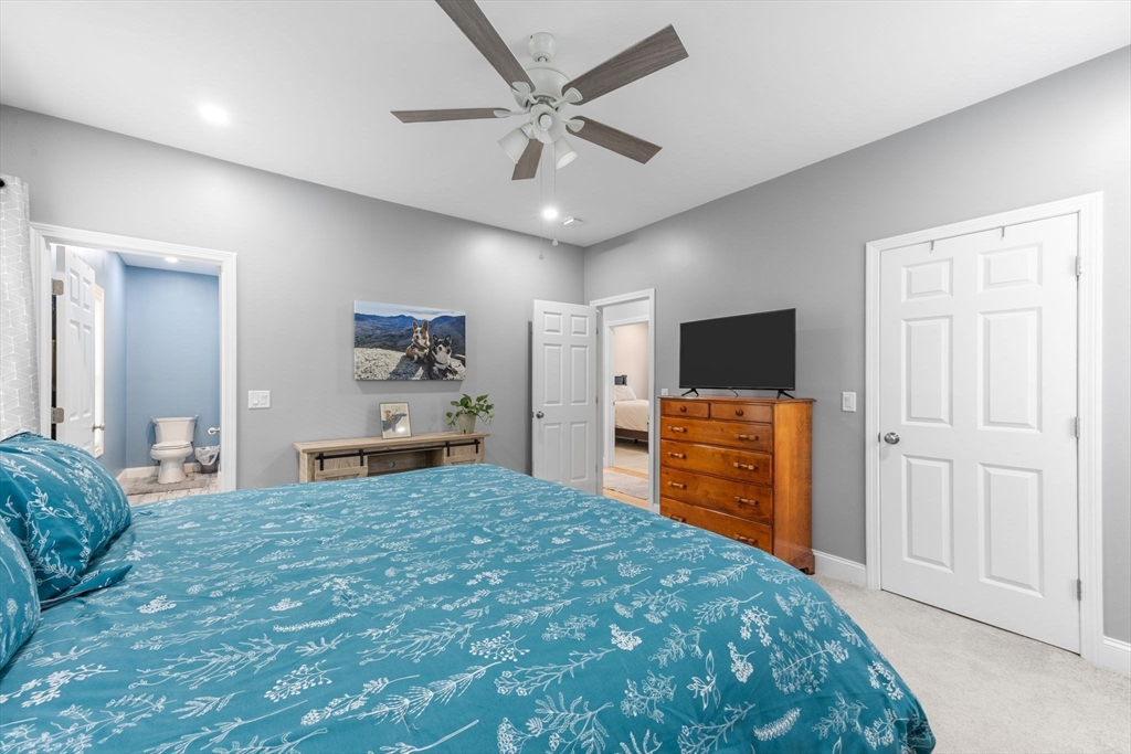 85 Waterhouse Road Bourne, MA 02532 - Photo 17 of 28 a bedroom with a bed and a flat screen tv