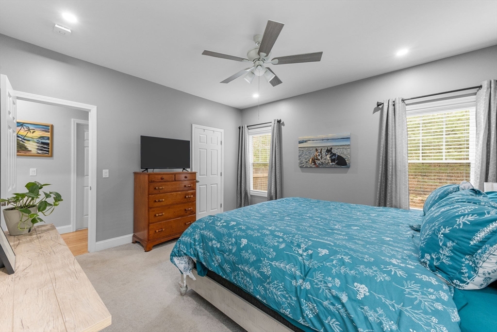 85 Waterhouse Road Bourne, MA 02532 - Photo 18 of 28 a bedroom with a bed and a television