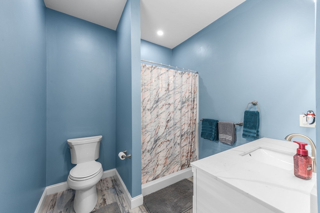 85 Waterhouse Road Bourne, MA 02532 - Photo 19 of 28 a bathroom with a sink a toilet and shower